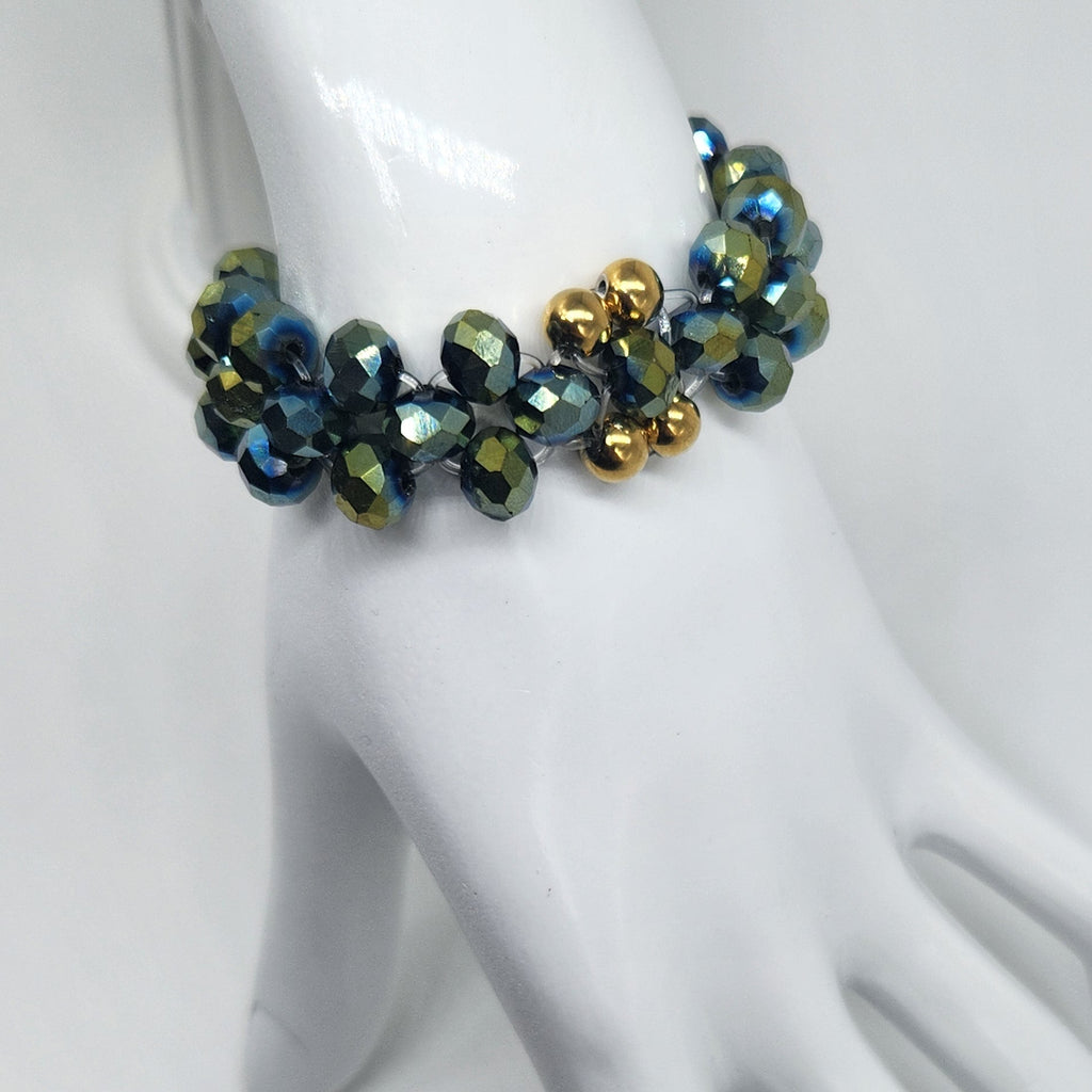 Beaded bracelet on a white mannequin hand against a light gray background